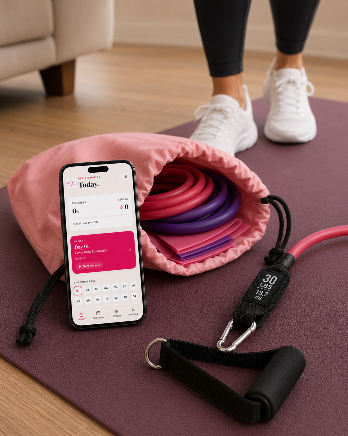 Movita resistance-band kit with blush-pink pouch and Resistance21 home-training system